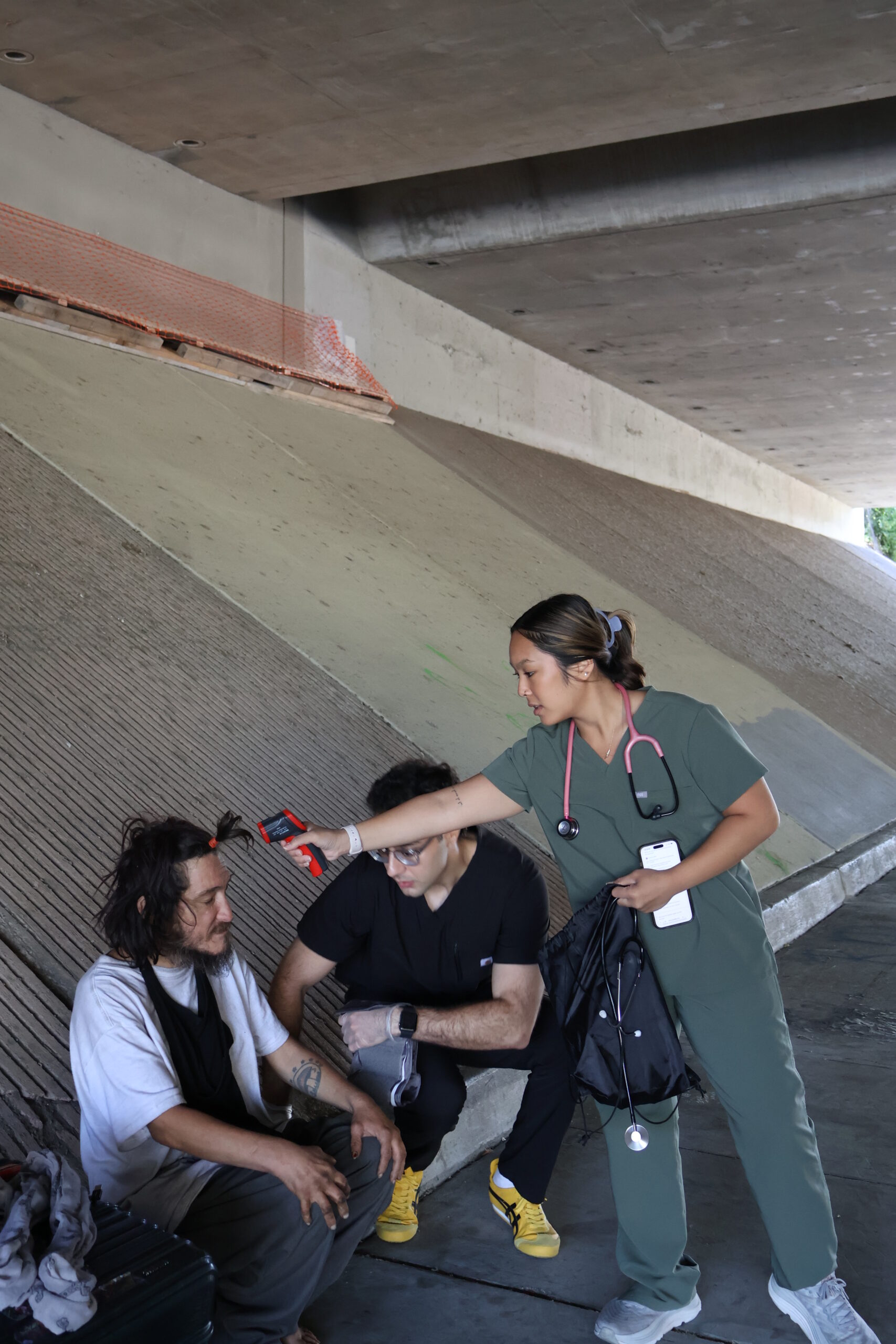 Valliant Foundation volunteer taking a forehead temperature during outreach