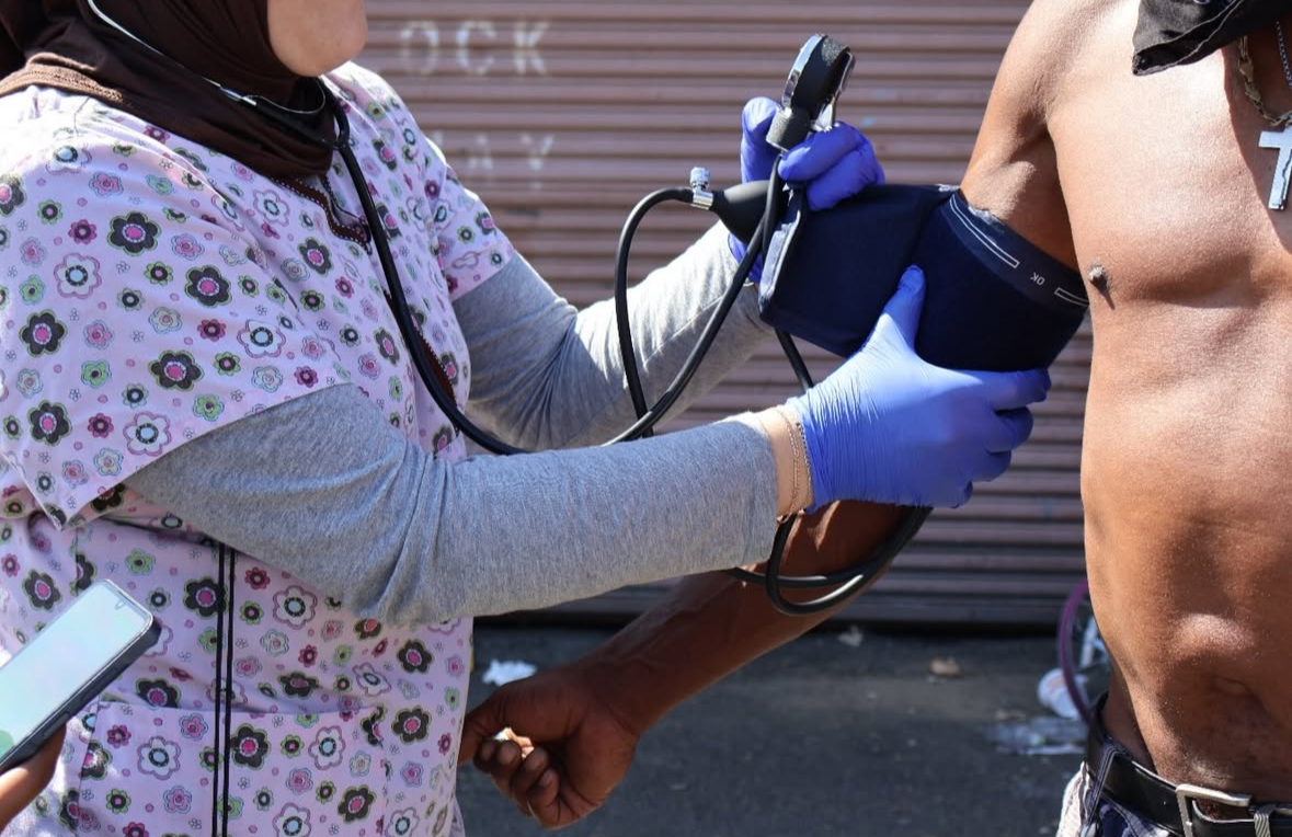 Valliant Foundation volunteers taking a blood pressure during outreach